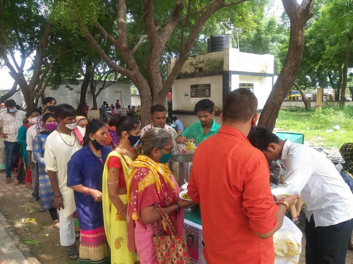 Community meal distribution under trees